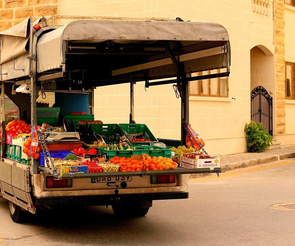 Baskets overflowing with fresh berries and grapes